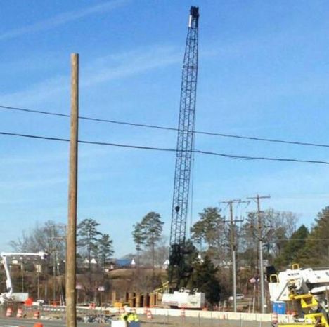 Unstable crane closes road